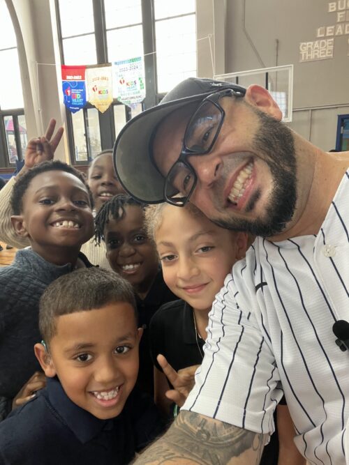 Students of Graceland Park O'Donnell Heights Elementary Middle School with Eddie Cortes